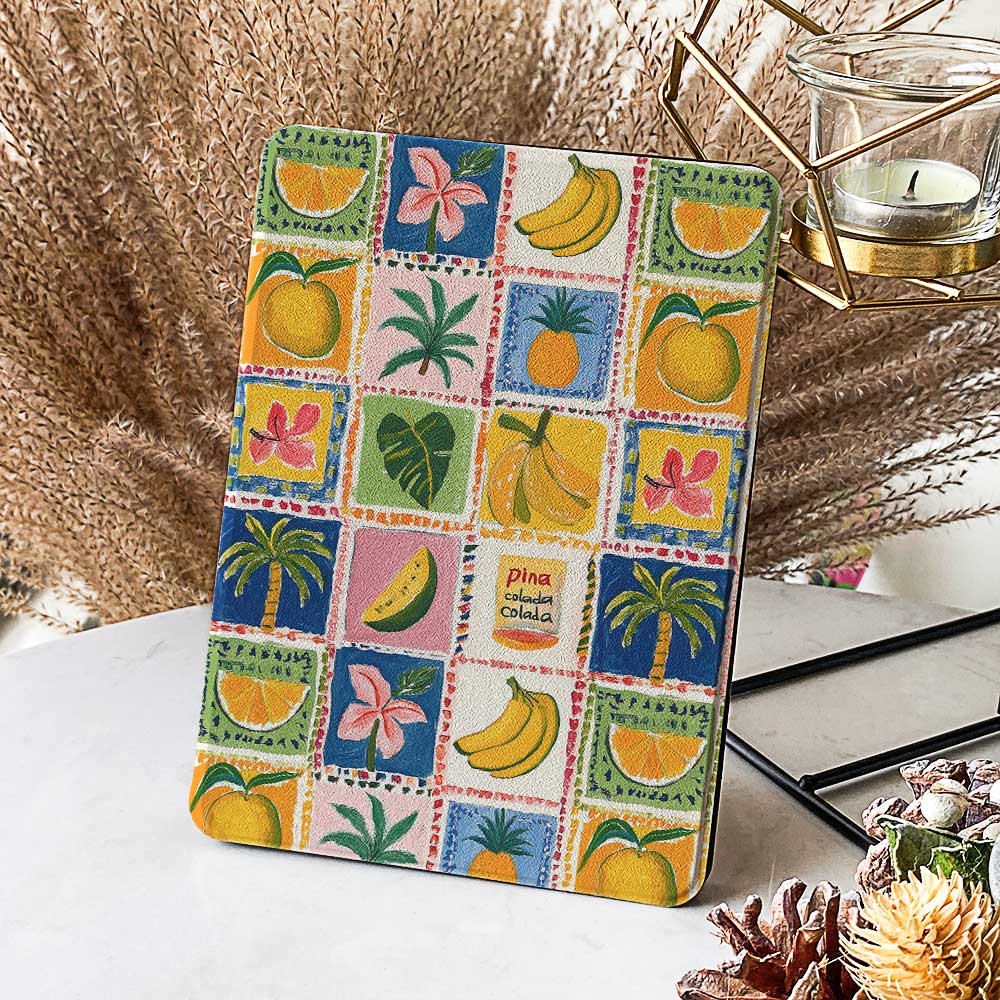 Fruit Fiesta Checkered Kindle design featuring stamps with fruits like orange, banana, pineapple, dragon fruit, watermelon, and mango, with colorful backgrounds in blue, yellow, pink, and red