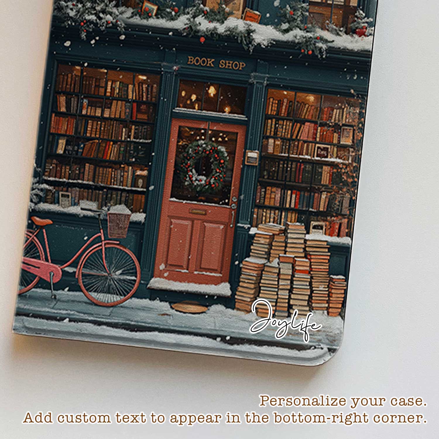 The ipad-pro-11-m4-case design features a bookstore in the snow with a red door and a black sign reading "Cherry." The store’s exterior and roof are covered in books, emphasizing its book-filled charm.