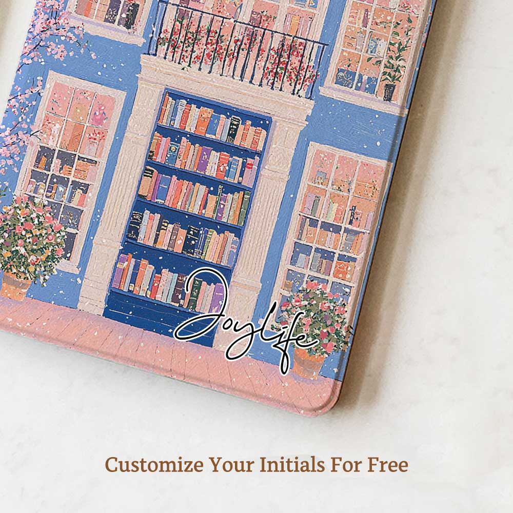A kindle_colorsoft_case design featuring a bookstore with a blue door and an arched window showcasing bookshelves inside. The store has white windows on either side, also displaying books. Two green potted plants sit at the entrance, adding vibrancy. The overall color scheme of blue and pink creates a warm and peaceful atmosphere.