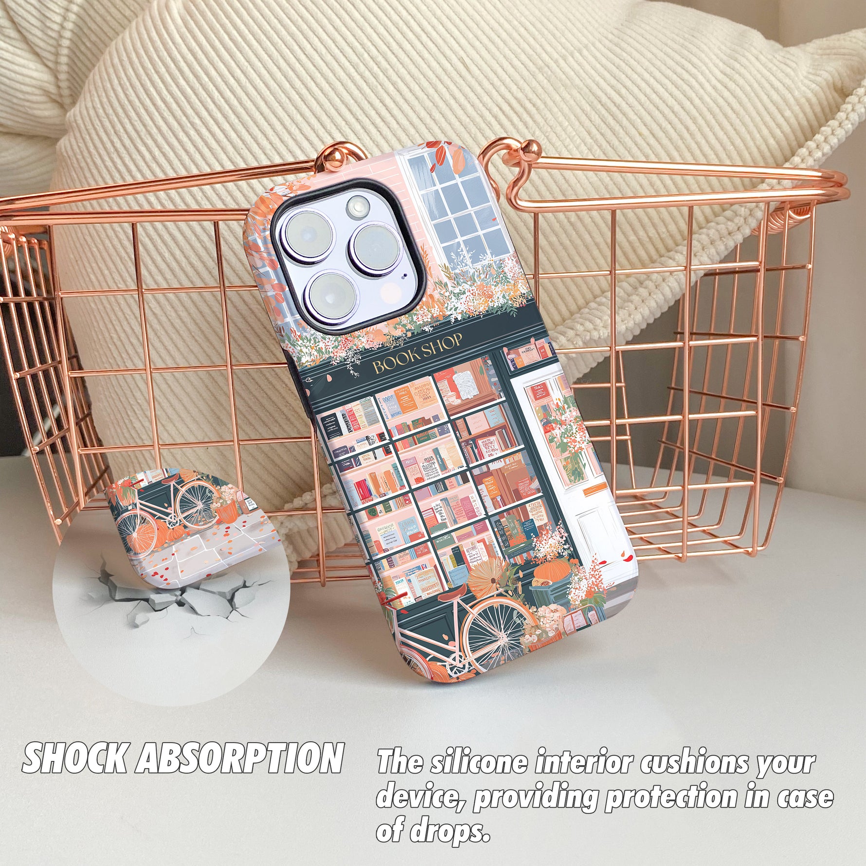 Phone case with book-themed design on a white surface with a basket in the background