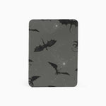 Dark gray card with black bat illustrations on a white background