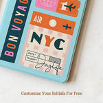 Colorful travel-themed notebook with 'Air NYC' design on a light background