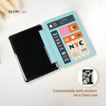 Customizable tablet case with travel-themed stickers on a white background