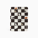 Checkered notebook with Halloween-themed icons on a white background