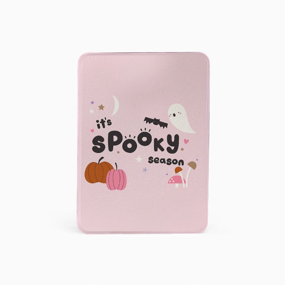 Pink notebook with Halloween-themed design on a white background