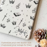 The case is displayed on a table with a Kindle Paperwhite device inside, showcasing the sleek design and perfect fit.