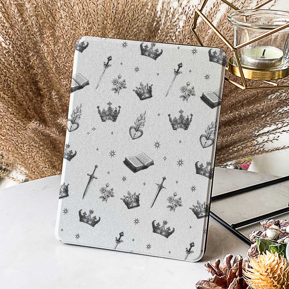 The case is displayed on a table with a Kindle Paperwhite device inside, showcasing the sleek design and perfect fit.