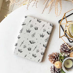 The case is displayed on a table with a Kindle Paperwhite device inside, showcasing the sleek design and perfect fit.