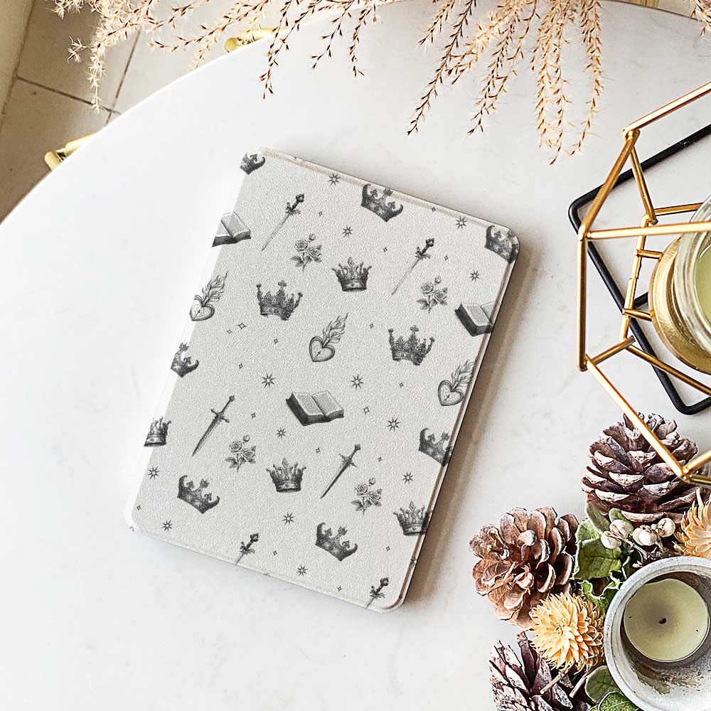 The case is displayed on a table with a Kindle Paperwhite device inside, showcasing the sleek design and perfect fit.
