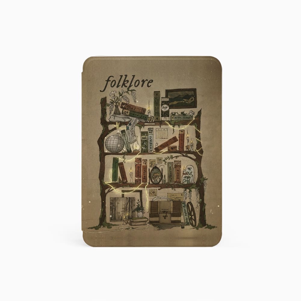 Small book or notebook with 'folklore' text and collage design on a white background