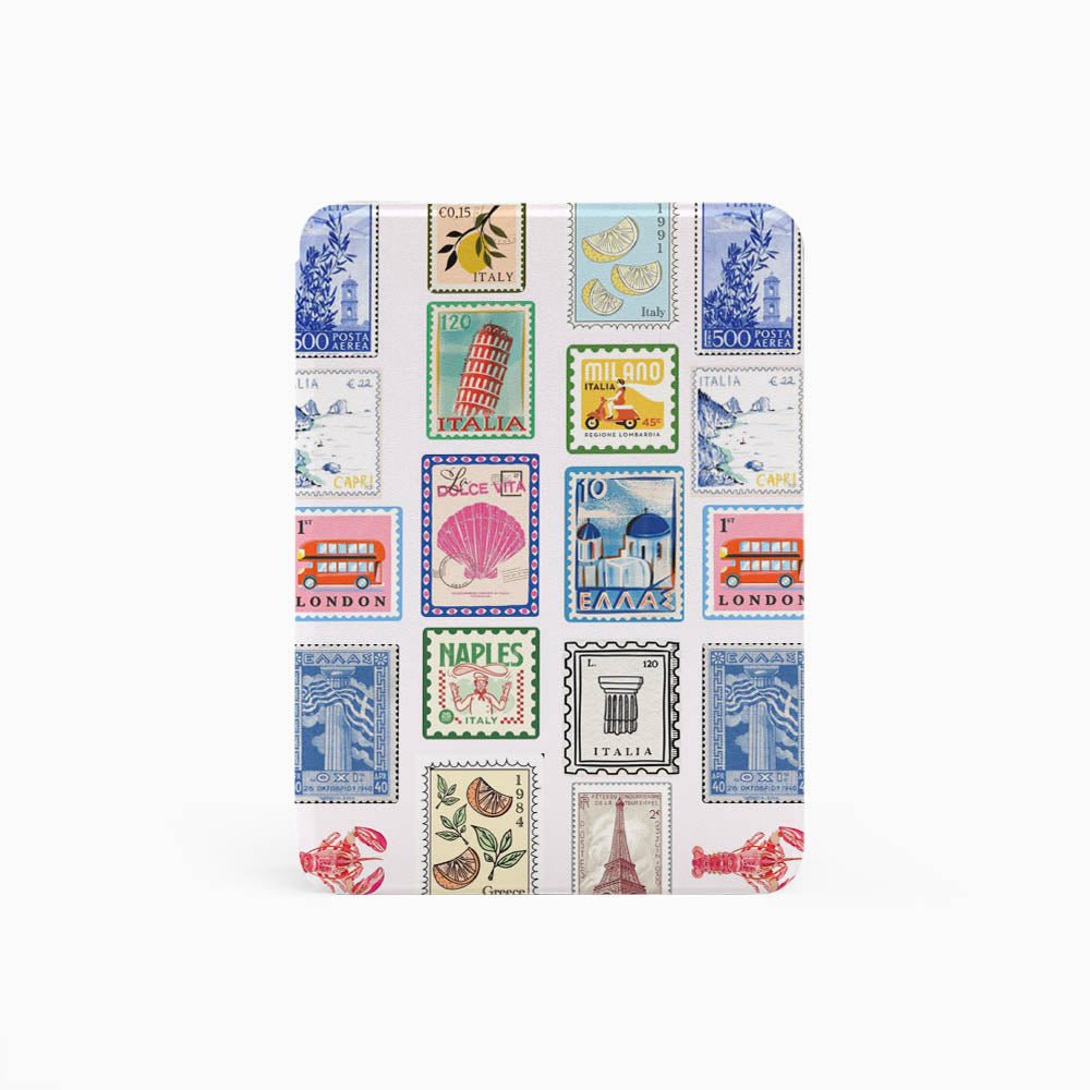 Small notebook with a design of colorful postage stamps on a white background