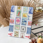 Tablet with a colorful stamp design on a decorative surface