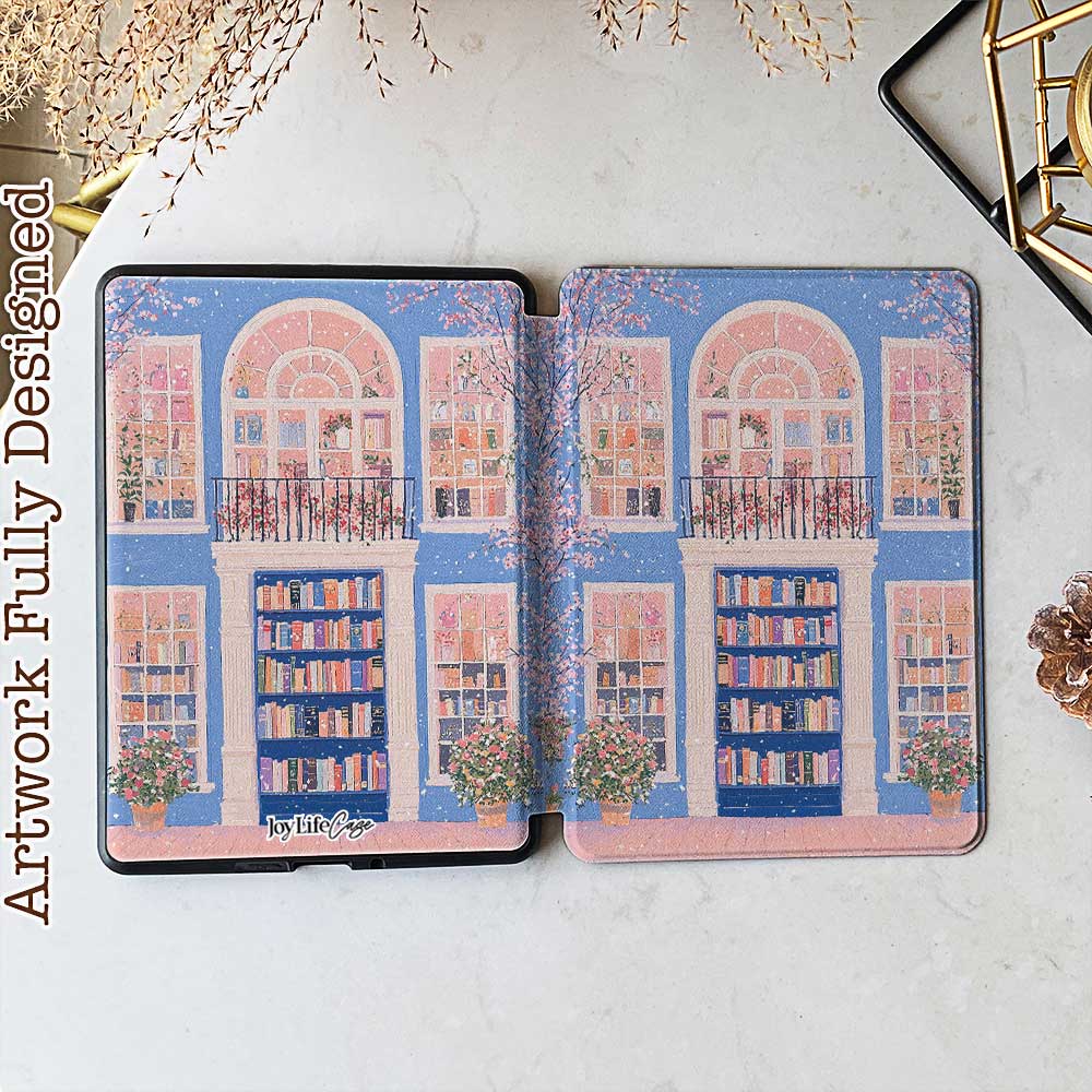 A kindle_colorsoft_case design featuring a bookstore with a blue door and an arched window showcasing bookshelves inside. The store has white windows on either side, also displaying books. Two green potted plants sit at the entrance, adding vibrancy. The overall color scheme of blue and pink creates a warm and peaceful atmosphere.